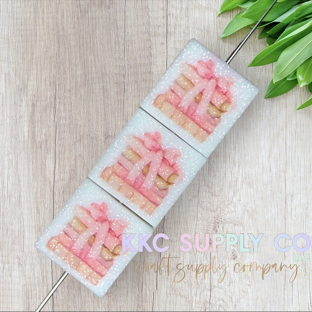 Coquette Bow Book Stack Glitter Printed Silicone Focal Bead