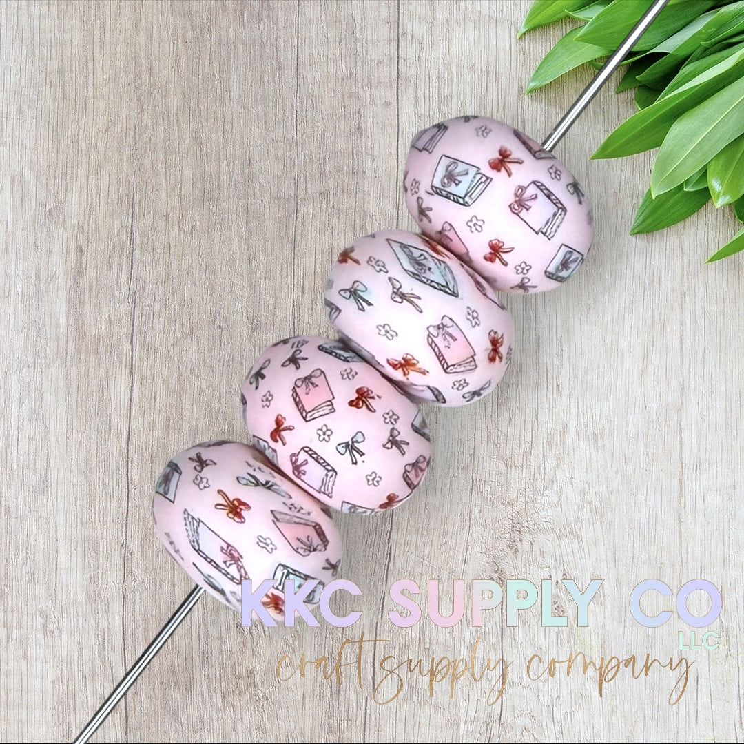 SP201-Coquette Bow Book Lover Silicone Abacus Bead 23mm