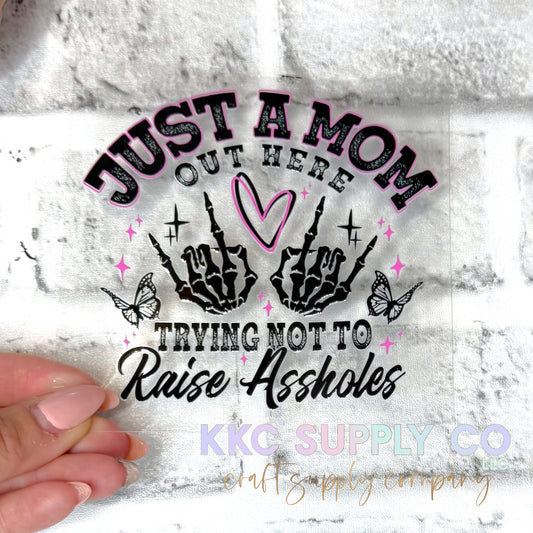 UV16666-Just A Mom Trying Not To Raise A$$holes UV DTF Decal